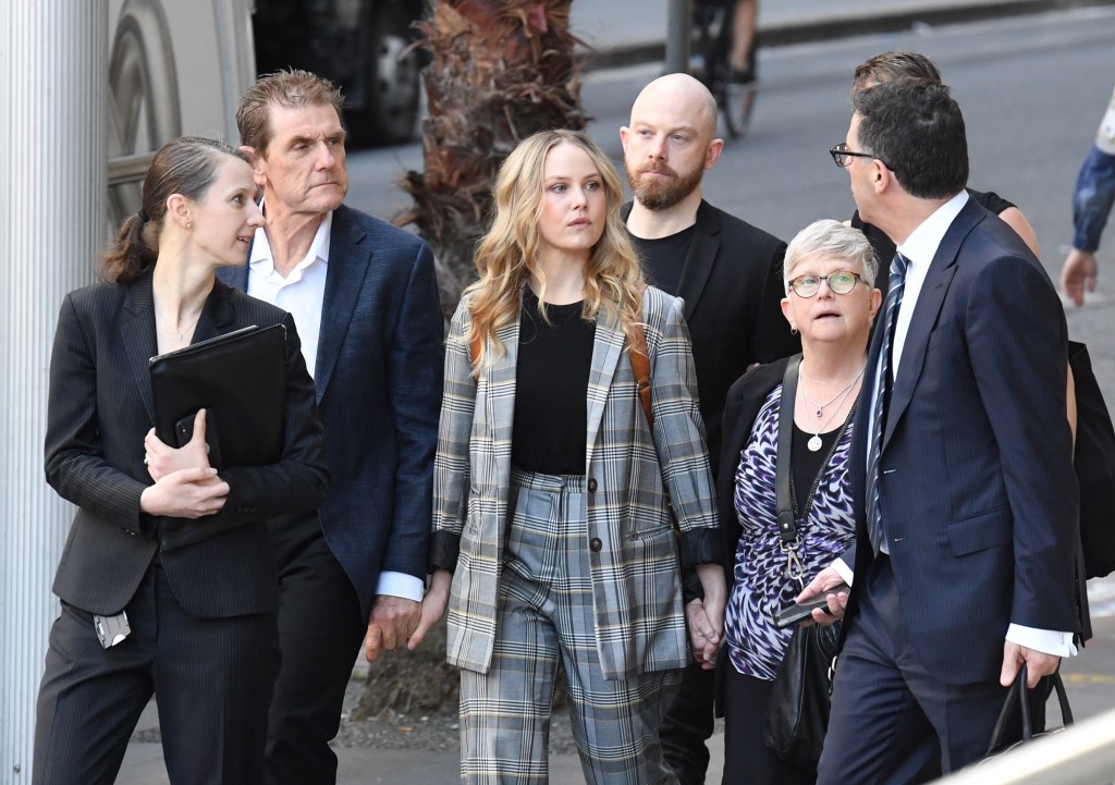 Actor Eryn Jean Norvill (centre) arrives the Federal Court before giving evidence in the Geoffrey Rush defamation case. Photo: AAP/Petter Rae