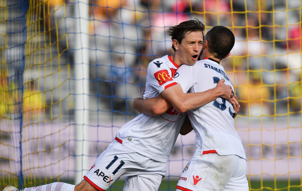Apostolos Stamatelopoulos (right) of United celebrates his goal with Craig Goodwin - the Reds' other goal-scorer. Photo: AAP/Brendan Esposito