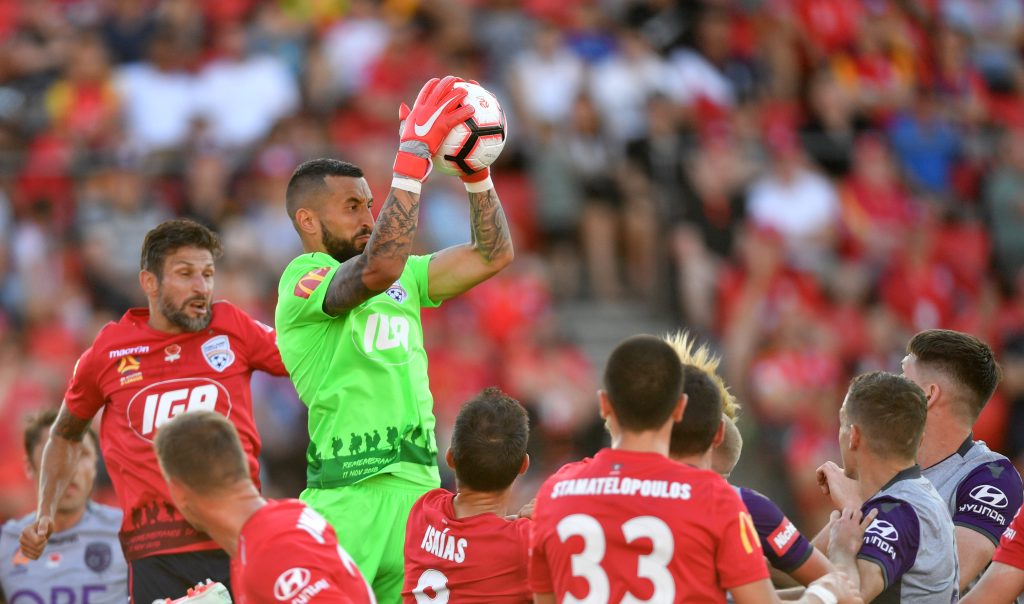 United goalkeeper Paul Izzo takes control against Perth Glory. Photo: AAP/David Mariuz