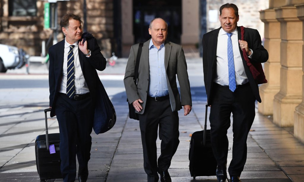 Jurgen Michaelis (centre) attending the District Court with his legal team earlier this year. Photo: Mark Brake / AAP