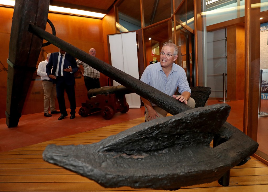 Prime Minister Scott Morrison in Cooktown with the anchor from James Cook's ship Endeavour. Photo: AAP/Marc McCormack