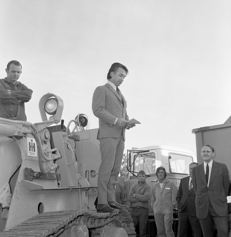 Don Dunstan standing on a bulldozer at the initiation of work ceremony for the construction of Flinders Medical Centre in 1972. Photo courtesy Dunstan Collection, Flinders University Library
 