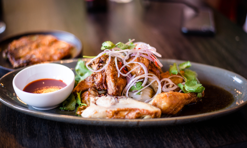 Smoked chicken gyoza with grilled wings, corn broth and a salsa and cucumber pickle will feature on the Henry's Table menu. Photo:  Nicholas Goh