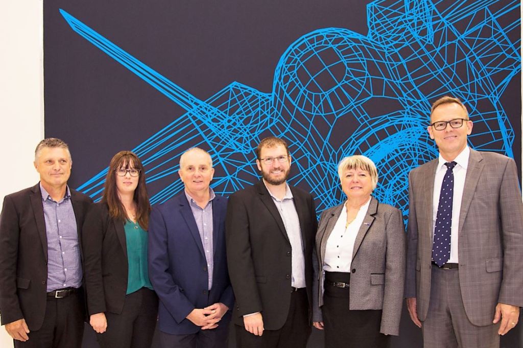 Flinders Professor John Spoehr, Pro-Vice Chancellor - Research Impact and Director of the Australian Industrial Transformation Institute, left rear; with Sarah Pope, Head of Aerostructures programs, RUAG; Fred Hull, Aerospace and Defence Manager, Axiom Precision Manufacturing; Craig Maynard, General Manager, Axiom Precision Manufacturing; Sharon Wilson, BAE's Australian Capability Director, Hunter Class Frigate Program; and AMGC Managing Director Dr Jens Goennemann.