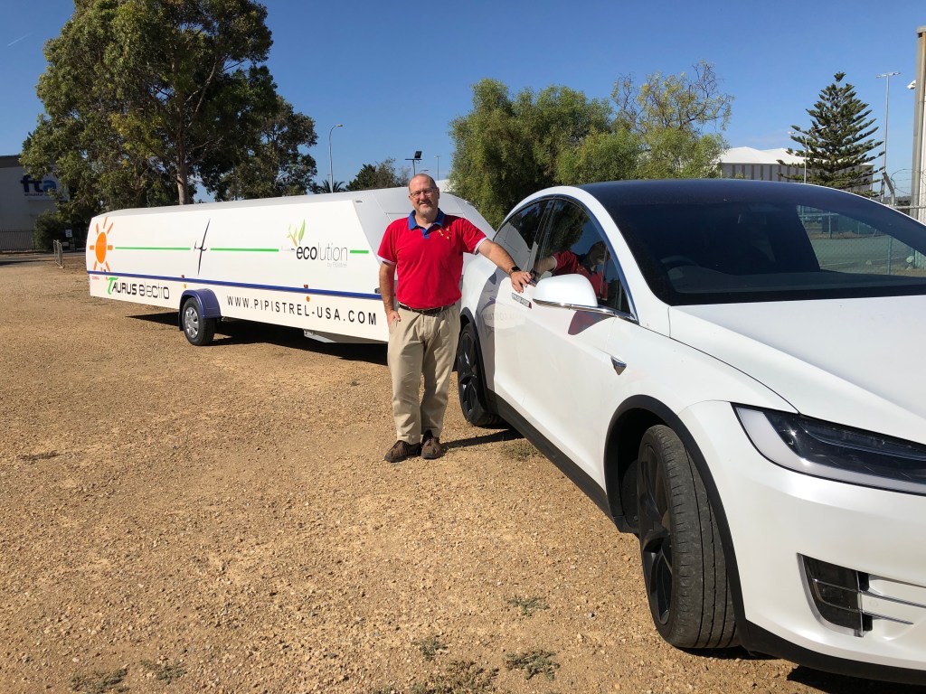 Simon Hackett with his Model X Tesla towing his electric plane. Photo: supplied