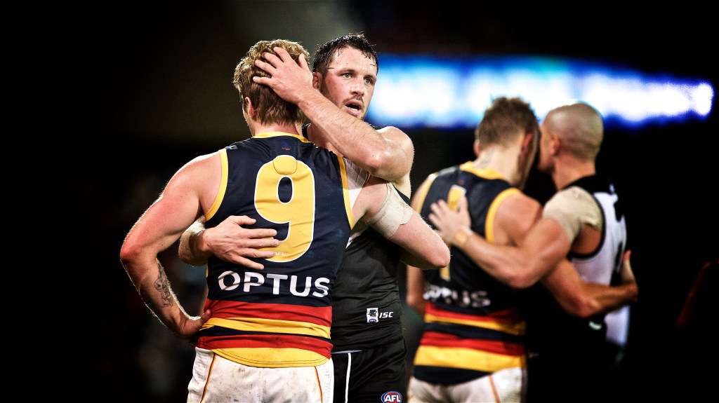 The players embrace graciously after the siren while your Fumbles correspondent celebrates smugly. Photo: Michael Errey / InDaily