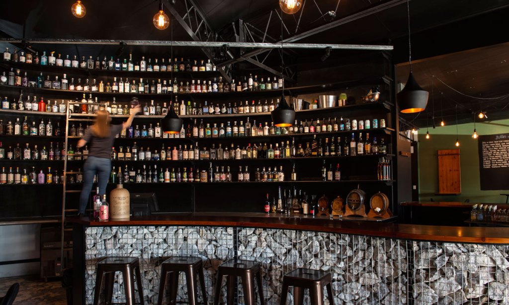 Musque's new bar features a wall of gin - and a ladder to reach it. Photo: What Pete Shot