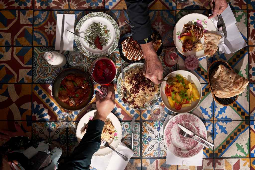 An array of dishes on the table at Parwana - one of Adelaide's favourite restaurants - photographed for SALIFE by Aubrey Jonsson