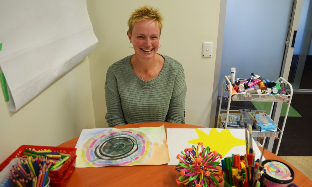 Kerrie with the results of an art therapy session. The star has special significance for her progress. Photo: Angela Skujins