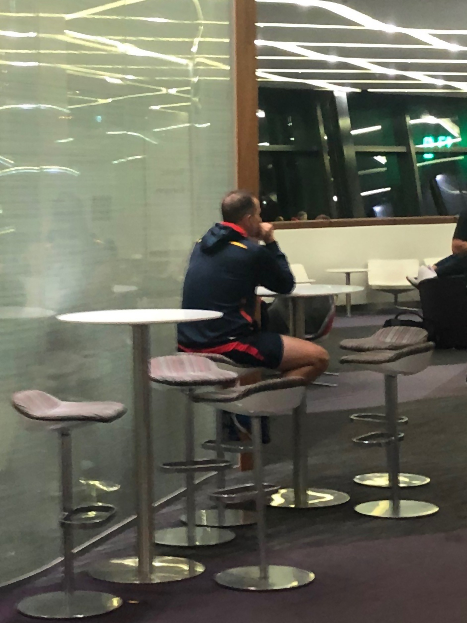 MR LONELY: Don Pyke cuts a poignant figure at Melbourne airport after the Crows' loss to Carlton.