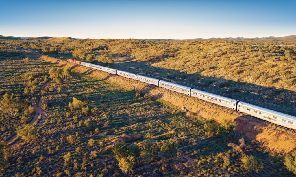 The Ghan heading north of Alice Springs through the MacDonnell Ranges. Photo: supplied