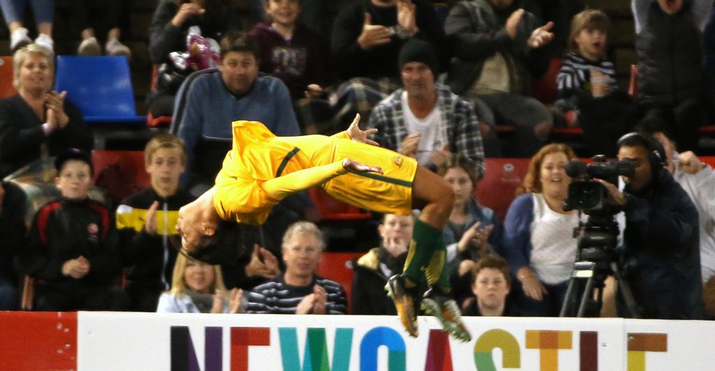 Matildas star Sam Kerr performs her trademark goal celebration against Brazil in 2017. Photo: Rick Rycroft / AP