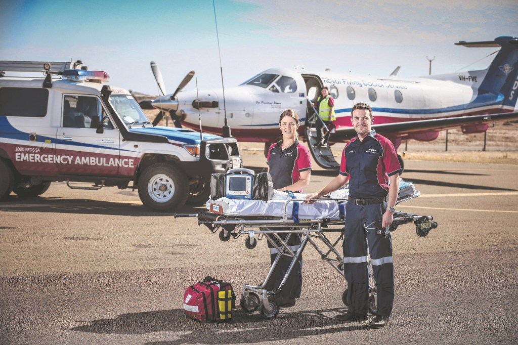 Nurse Caitlyn Keller and Dr Dustin Mattie on the tarmac at Marree. Photo: Mike Burton