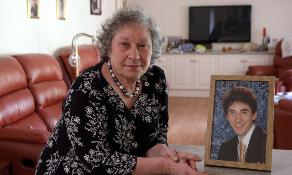 LifeLine volunteer Angela Henwood with a portrait of her son, Jonathan, who died in 2008. Photo: Tony Lewis