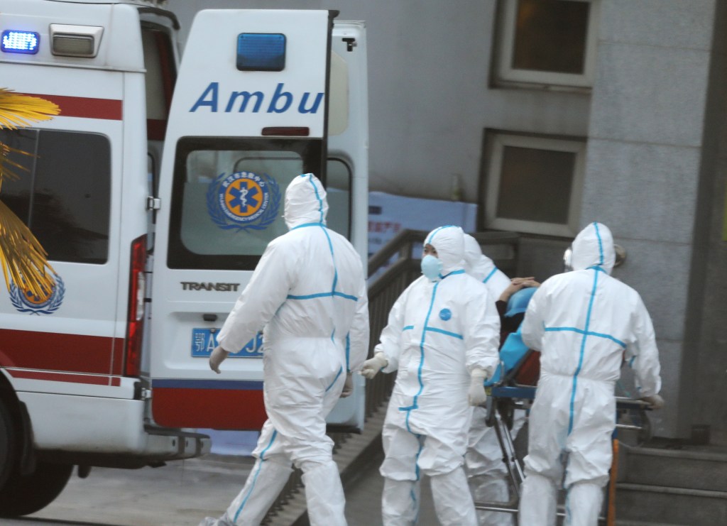 Medical staff transfer patients with the virus. Photo: supplied