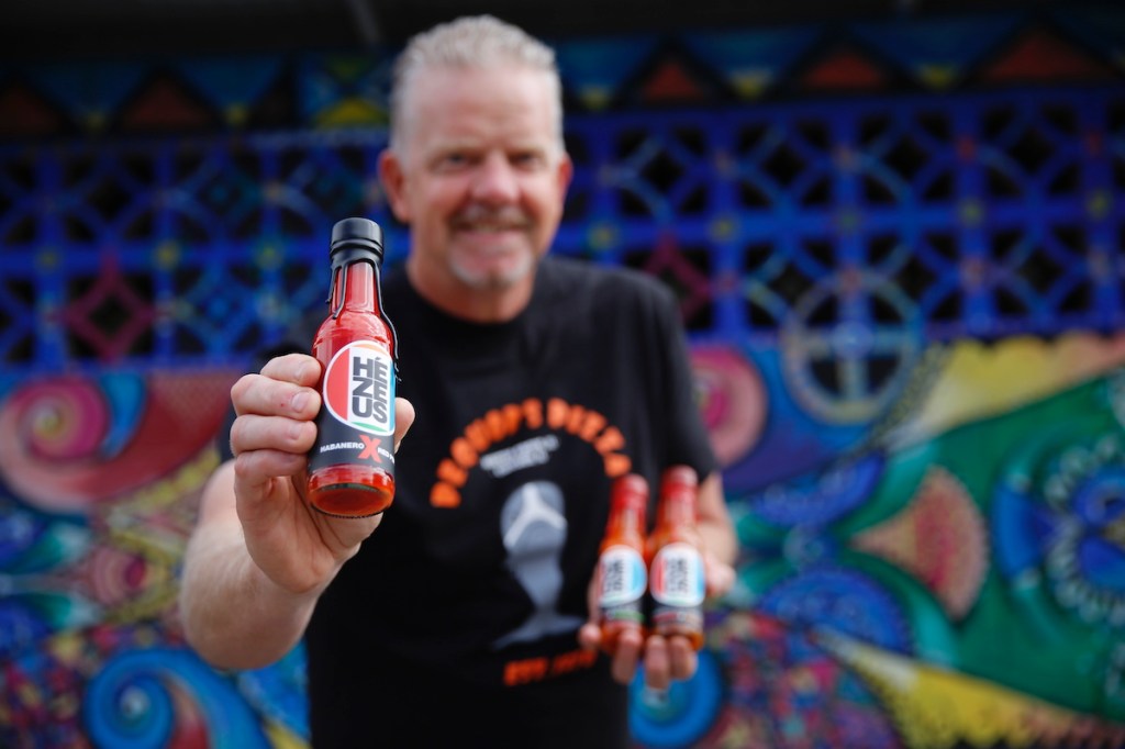Product designer Charlie Lawrence has launched his home-grown Hézeus Chilli Sauce. Photo: Ben Kelly.