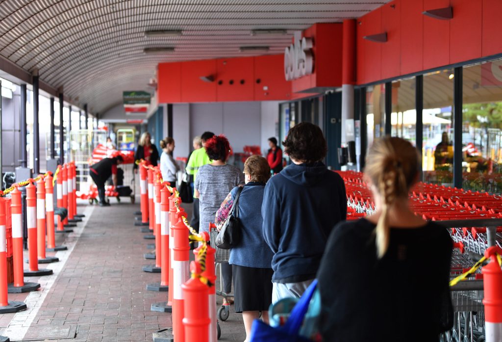 Shoppers outside a Coles supermarket at Firle. Photo: AAP/David Mariuz