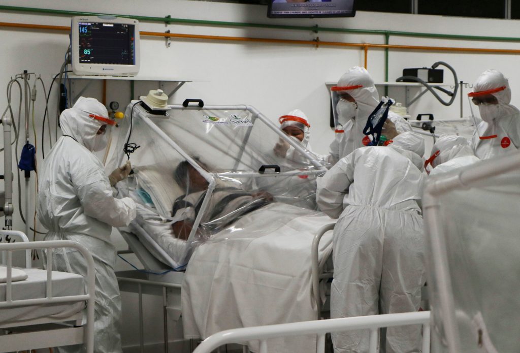 A COVID-19 patient is treated at a hospital in Brazil. Photo:AP/Edmar Barros