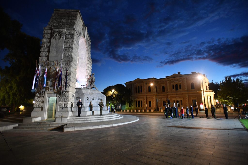 A small crowd gathers at yesterday's Anzac Day Dawn Service at the National War Memorial in Adelaide Photo:AAP/David Mariuz 