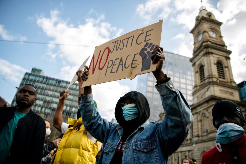 Protesters participate in a Black Lives Matter rally in Adelaide on Saturday. Photo: AAP/Morgan Sette