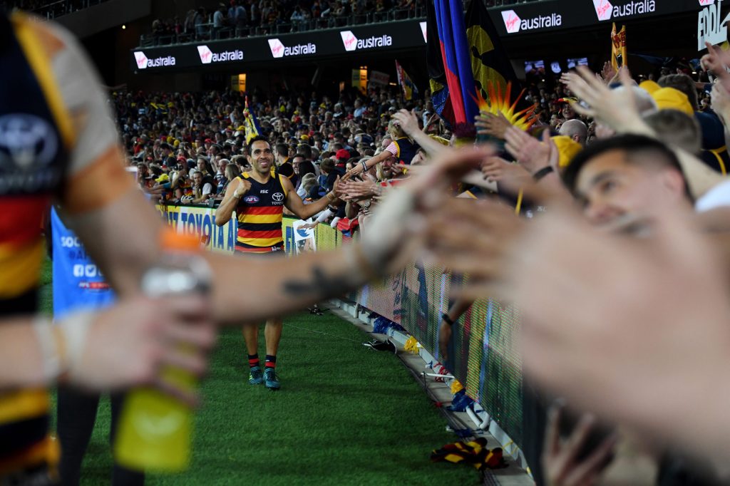 The high watermark: Eddie Betts celebrates with fans after the Crows thrashed Geelong in the 2017 preliminary final.  Photo: AAP/Tracey Nearmy