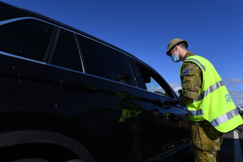 An ADF member at a checkpoint outside Melbourne during the city lockdown. Photo: AAP /James Ross
