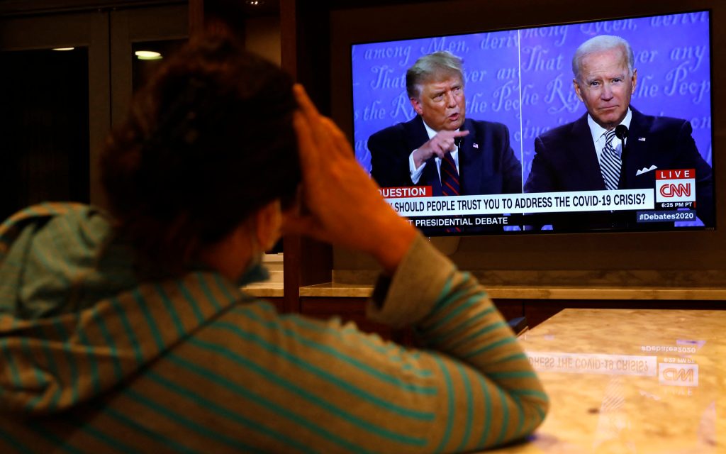 A woman in Washington watches the first presidential campaign debate between President Donald Trump and Democratic presidential nominee Joe Biden. Photo: Yuri Gripas/ABACAPRESS.COM