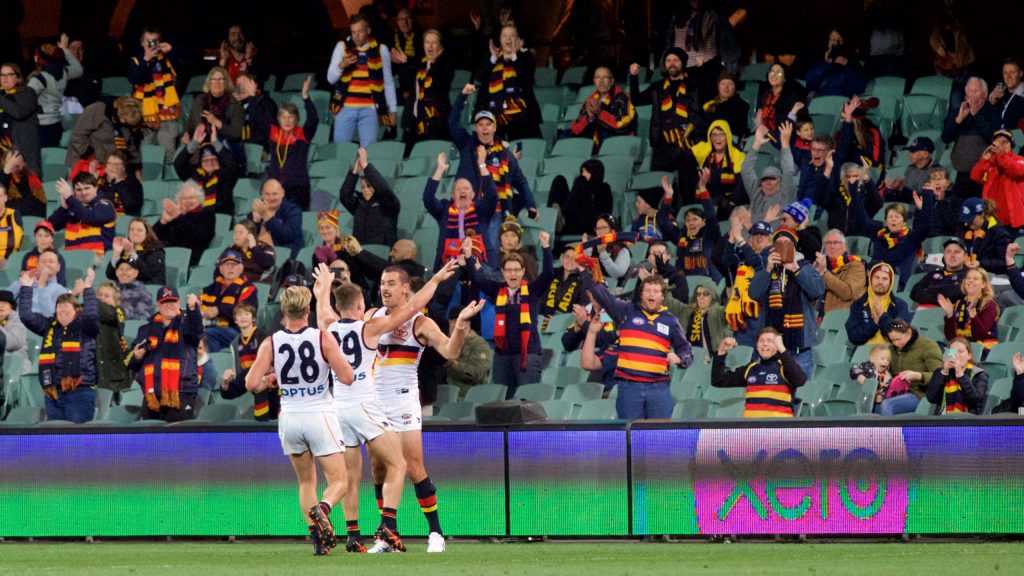 At last, the players and spectators have something to celebrate, as the signage on the boundary no longer points to our winning tally in 2020. Photo: Michael Errey / InDaily