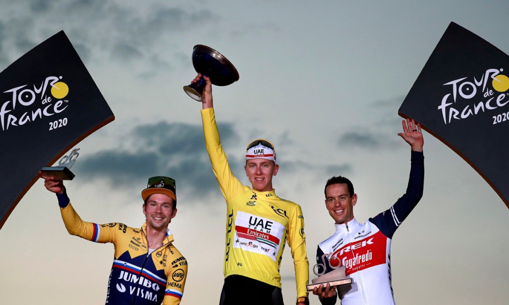 Richie Porte, right, has become only the second Aussie cyclist to finish on the Tour de France podium after securing third place in the event behind Slovenian riders  Tadej Pogacar and Primoz Roglic. Picture: Christophe Petit-Tesson/EPA