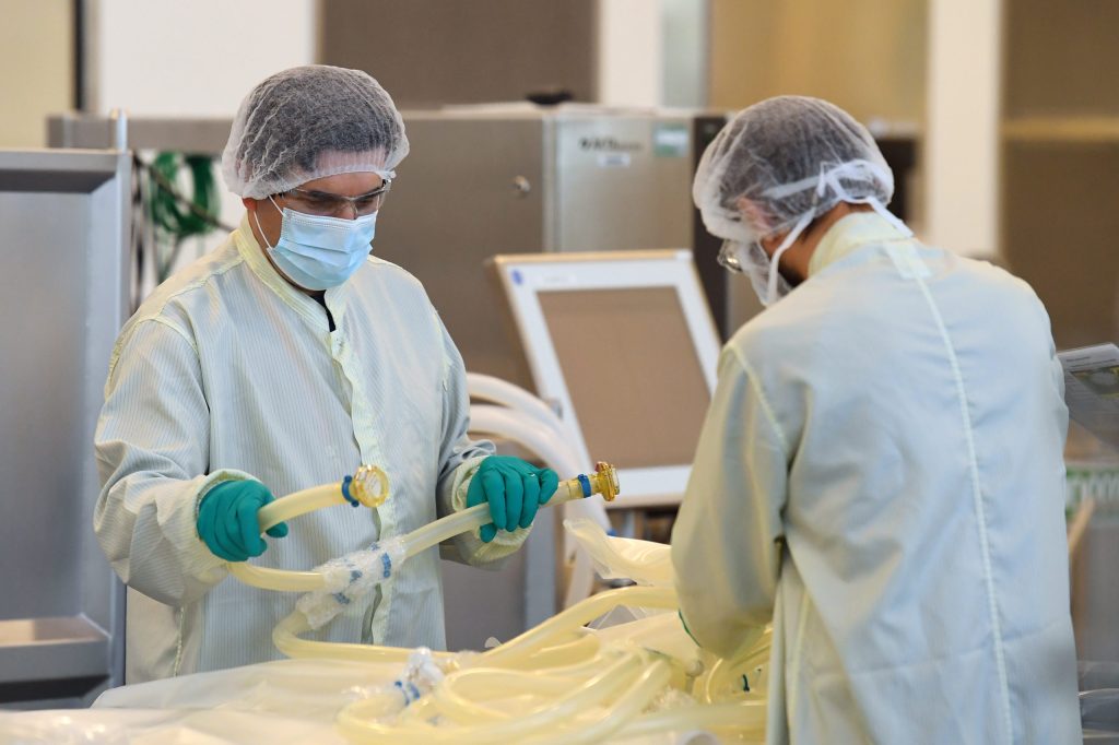 CSL staff work at a biotech lab in Melbourne. Photo: AAP/James Ross