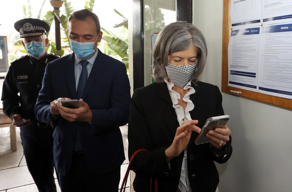 Police Commissioner Grant Stevens, Premier Steven Marshall and Professor Nicola Spurrier checking in with the QR system last year. Photo: Tony Lewis/InDaily