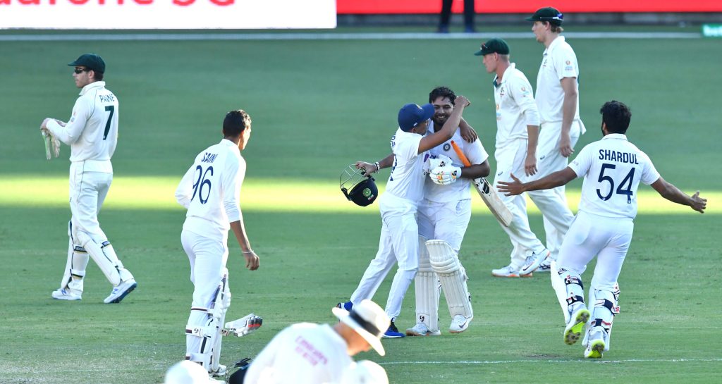 Rishabh Pant celebrates with teammates after victory on day five of the fourth Test. Photo: Darren England / AAP
