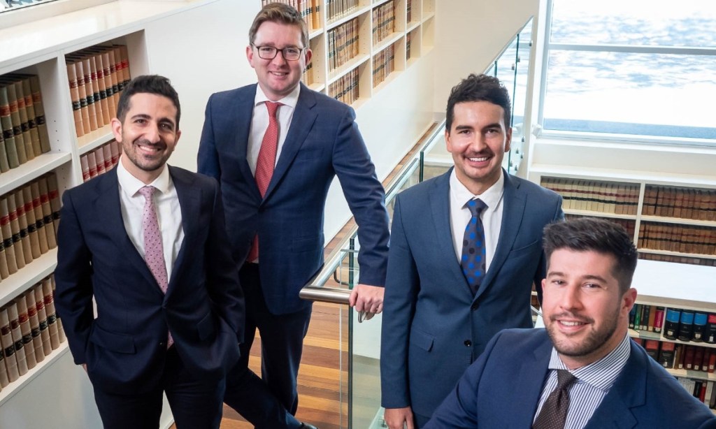 CCK Lawyers staff (from left) John Vozzo, Sam de Cure, Hamish Gillis and Victor Draghicescu have recently earned promotions. Image: Supplied