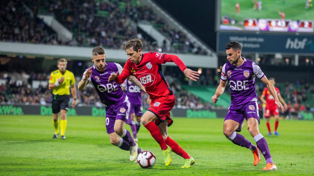Craig Goodwin competes against Perth Glory. Photo: AAP/Tony McDonough
