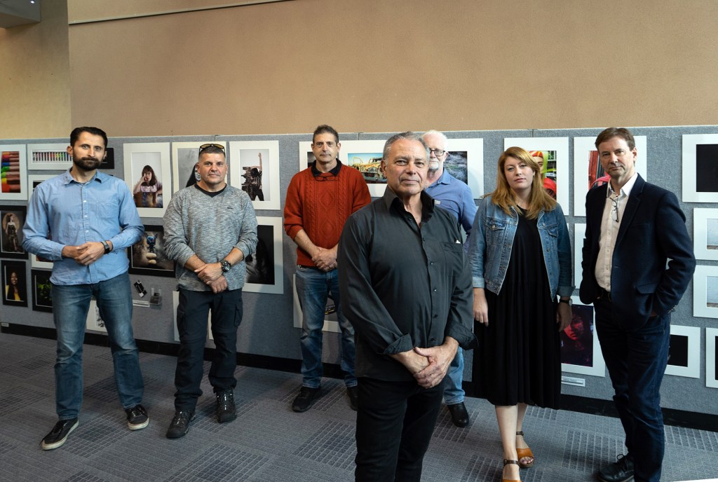 Teacher Malcolm Cheffirs (front) with former students and photography professionals concerned about changes to vocational courses
Photo: Tony Lewis / InDaily
