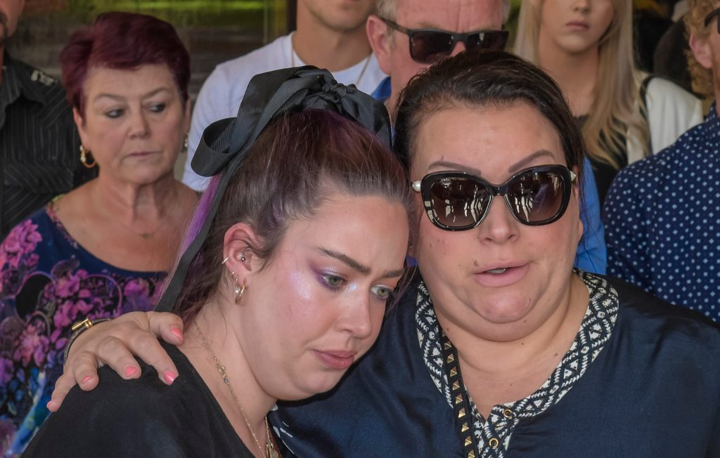 Chelsea Ireland's sister Maddie Ireland (left) and Lukasz Klosowski's mother Magda Pearce outside the Adelaide Supreme Court after South Australian man Pawel Klosowski who shot and killed his son, Lukasz Klosowski, and his son's girlfriend, Chelsea Ireland, was jailed for at least 34 years. (AAP Image/Roy Vandervegt)