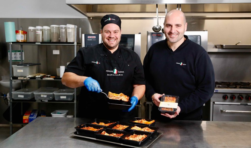 Nonna's Cucina executive chef Stefan Dimasi and general manager Marco Staltari prepare meals to be delivered to clients. Photo: Ben Kelly.