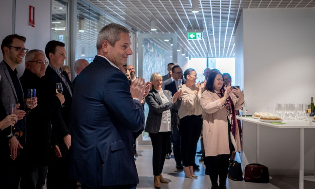 Tic:Toc founder and CEO Anthony Baum applauds the official opening of the digital lender's new Adelaide headquarters. Picture: Supplied