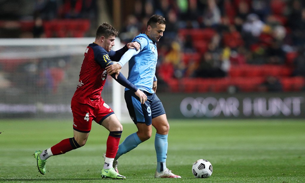 United's Ryan Strain and Sydney FC's Deyvison Da Silva during the clubs' last clash in May. Photo: AAP/Sarah Reed