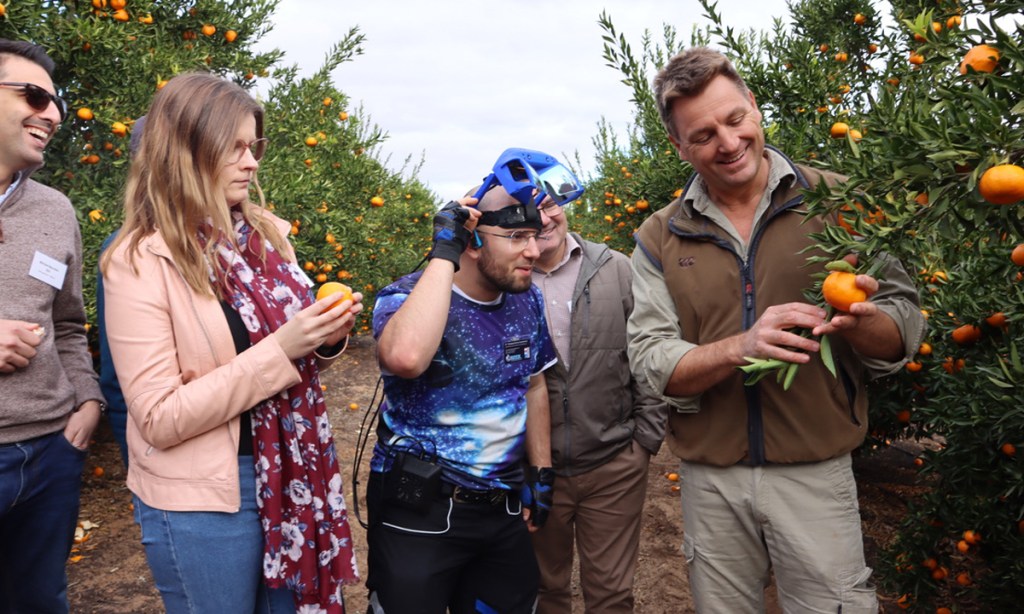 Woolenook Farms managing director Ben Haslett (right) with AgTech developers during a Riverland field trip.
