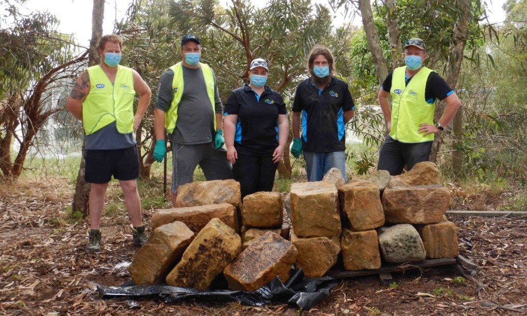 Members of the Barossa chapter of OzFish helped clean the blocks before installation in Warren Reservoir.