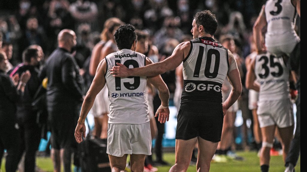 Travis Boak shares a moment with Eddie Betts, who is expected to confirm his retirement today. Photo: Michael Errey / InDaily
