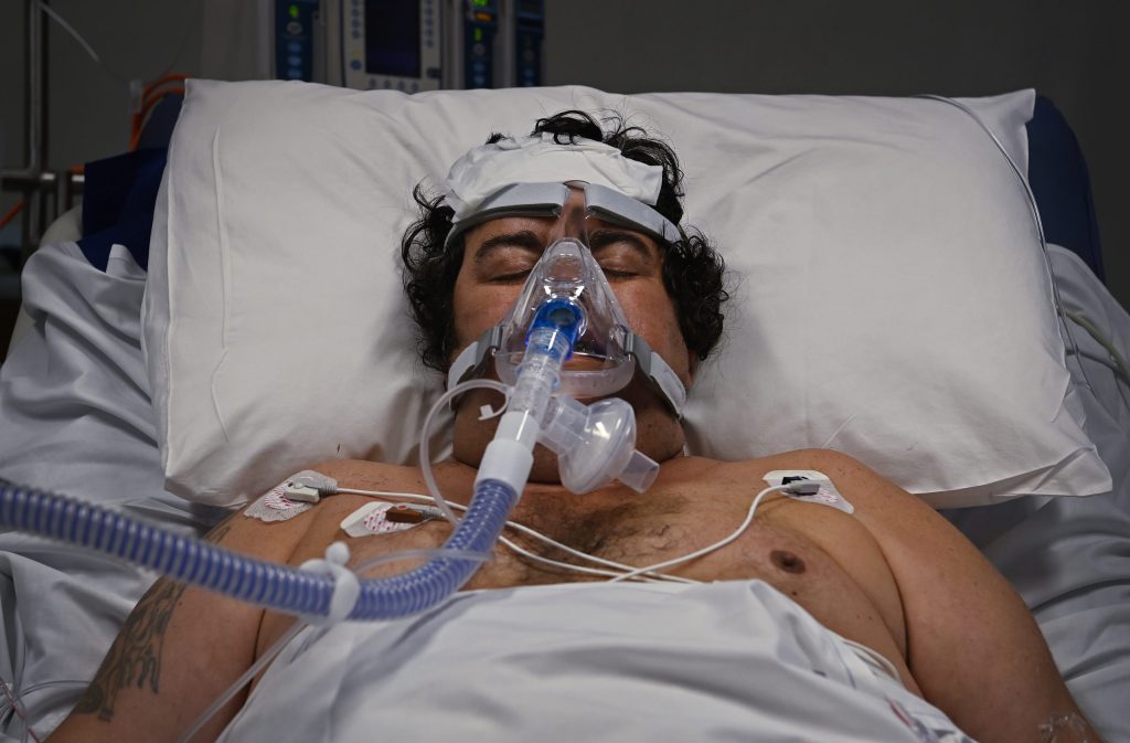 A COVID-19 patient in the ICU of St Vincent’s Hospital in Sydney. Photo  AAP/Kate Geraghty/SMH/St Vincent’s Hospital