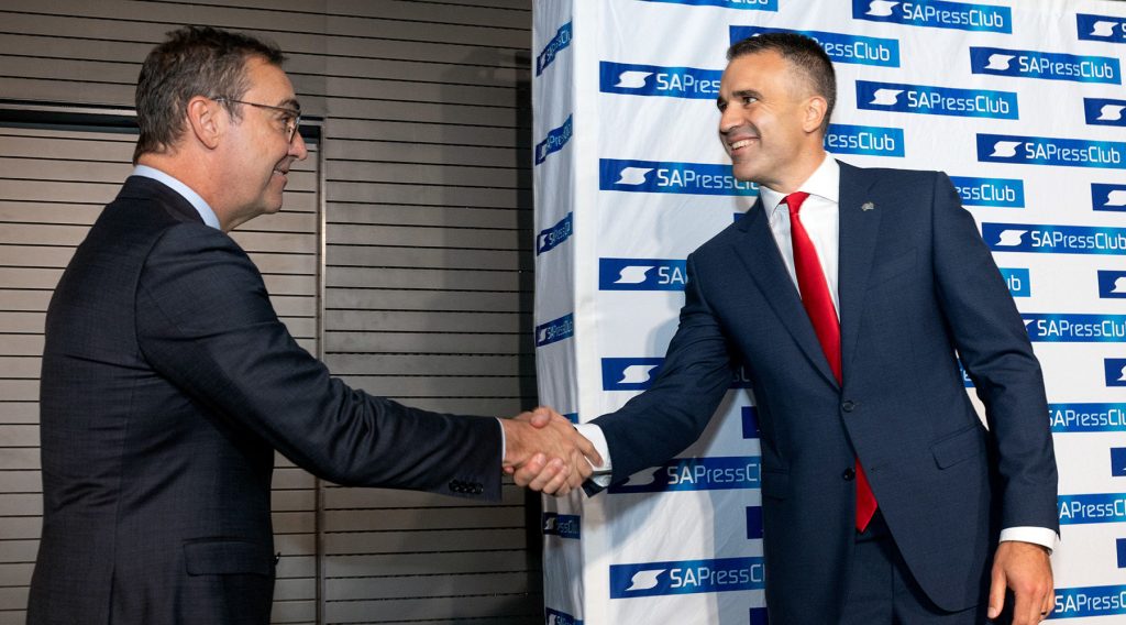 Steven Marshall and Peter Malinauskas shake hands at an SA Press Club debate in march. Photo: Tony Lewis / InDaily
