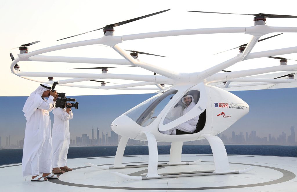 Dubai's Crown Prince with a German-built flying taxi drone in 2017. Photo: Reuters/Satish Kumar