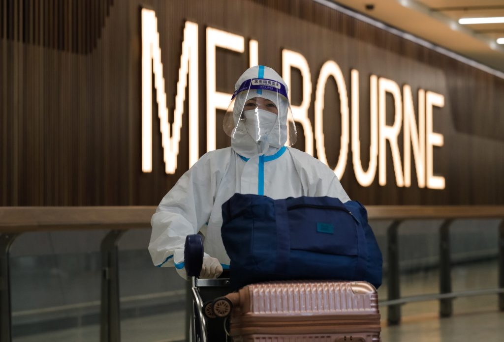 An overseas passenger arrives in Melbourne on on Wednesday. Photo: AAP/Con Chronis