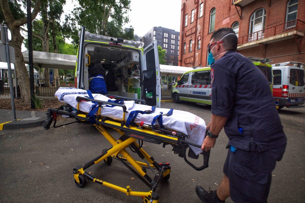 Victoria has declared a code brown emergency for Melbourne hospitals and six in the regions as the system buckles under COVID-19 admissions (AAP Image/Luis Ascui). 