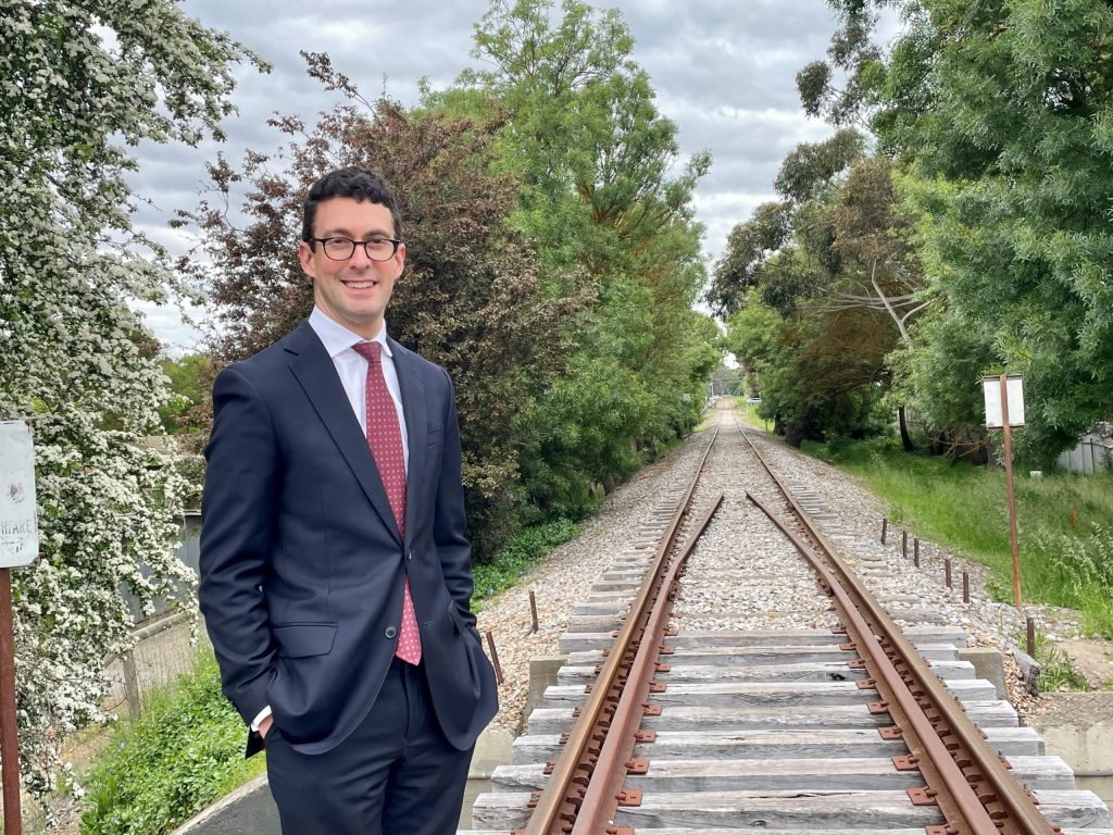 Independent MP Dan Cregan poses beside the rail line in Mount Barker, which Infrastructure SA has rejected as a solution to ease congestion on the South Eastern Freeway.  