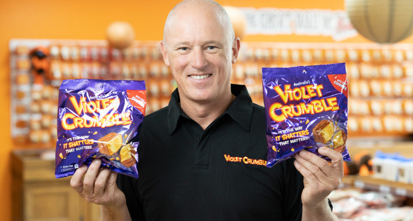 Menz Confectionery CEO Phil Sims with the company's biggest selling product, Violet Crumble.