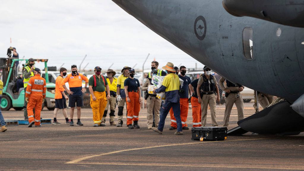 The RAAF's C-27J Spartan transport aircraft delivering food supplies at Coober Pedy airport on Monday. (Image: Supplied by The Department of Defence/Jarrod Mulvihill)